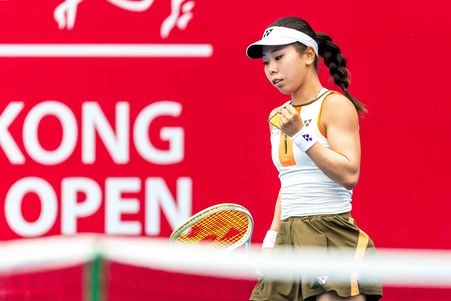 Japanese tennis player celebrates a point during the WTA 125 event at the Hong Kong Open, showcasing determination and skill.