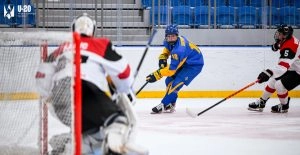 U20 Ukraine vs Austria ice hockey match, focusing on teamwork and resilience amid challenging circumstances.