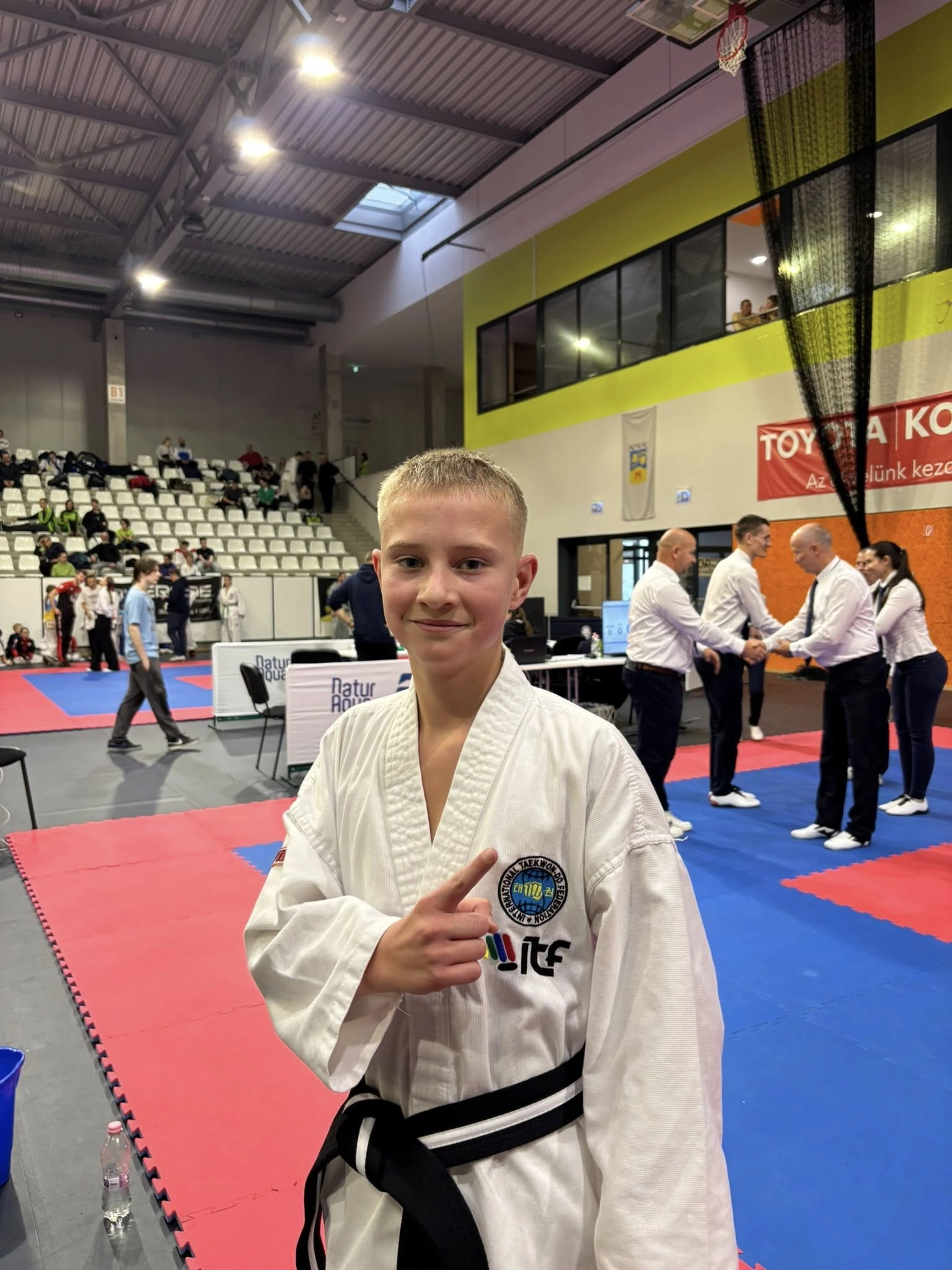 Ukrainian Taekwondo team member proudly showcases their skills at the XII Mightyfist Open Eagles Cup in Hungary, 2025.