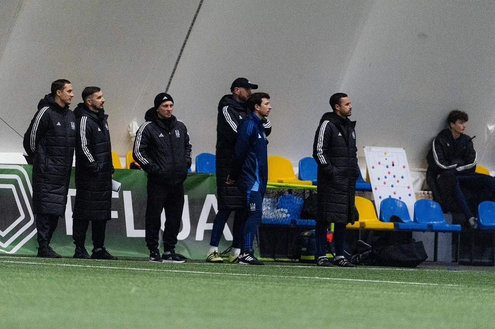 Coaches observe young footballers during Ukraine
