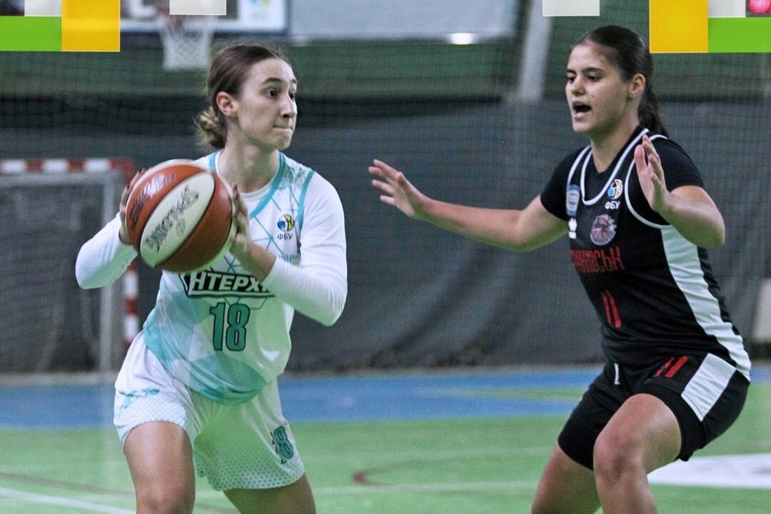 Basketball players in action during the Women